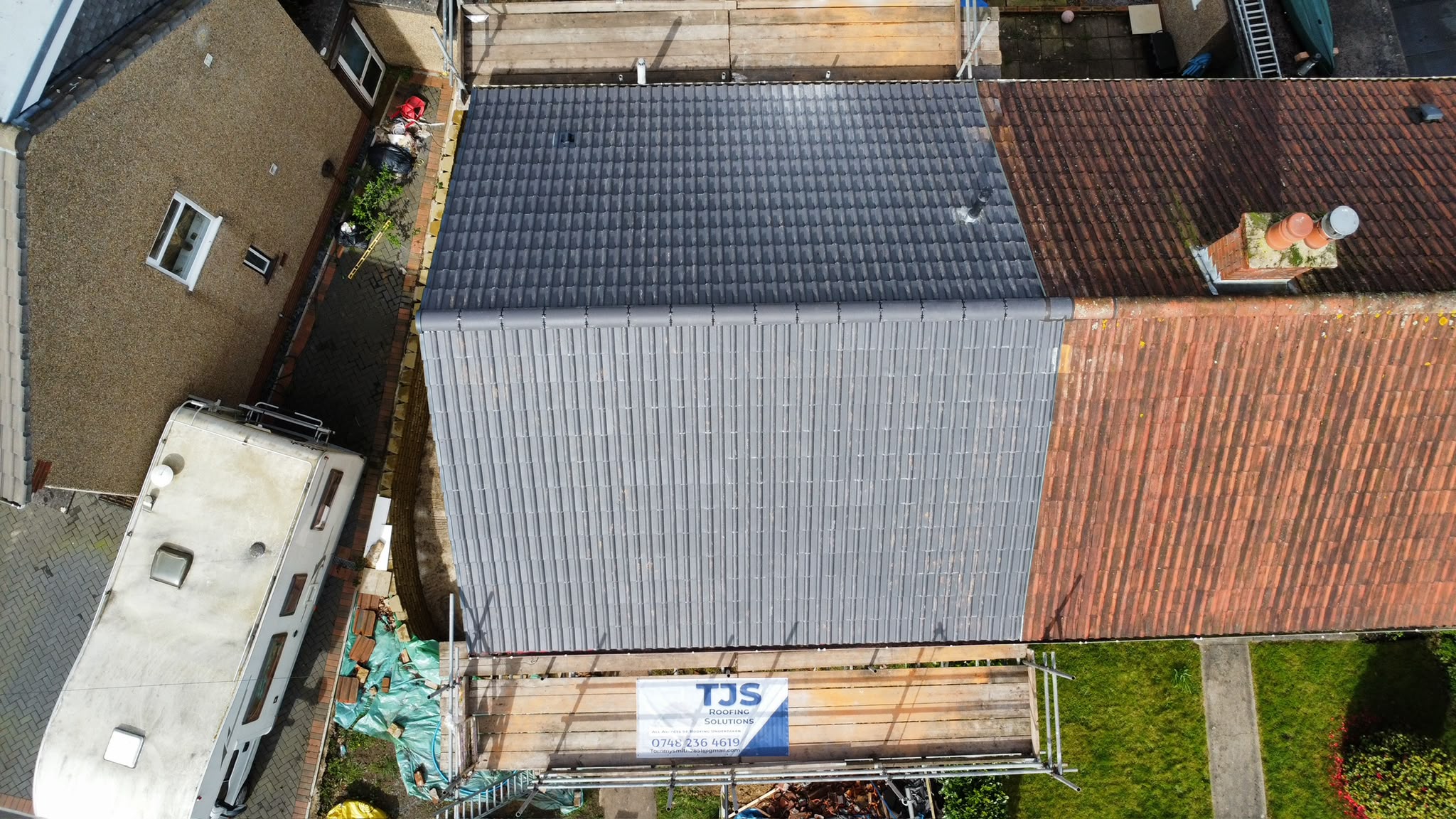 Aerial view of tiled roofing from TJS Roofing Solutions