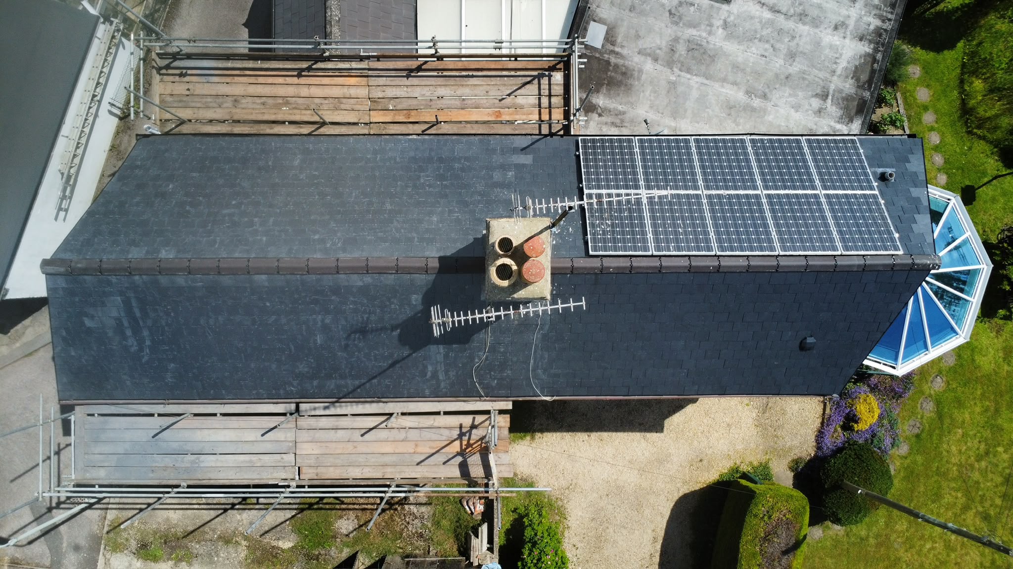 Roof with solar panels from TJS Roofing Solutions