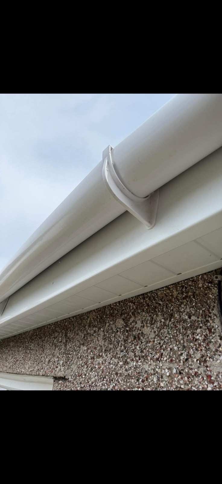 White guttering detail from TJS Roofing Solutions